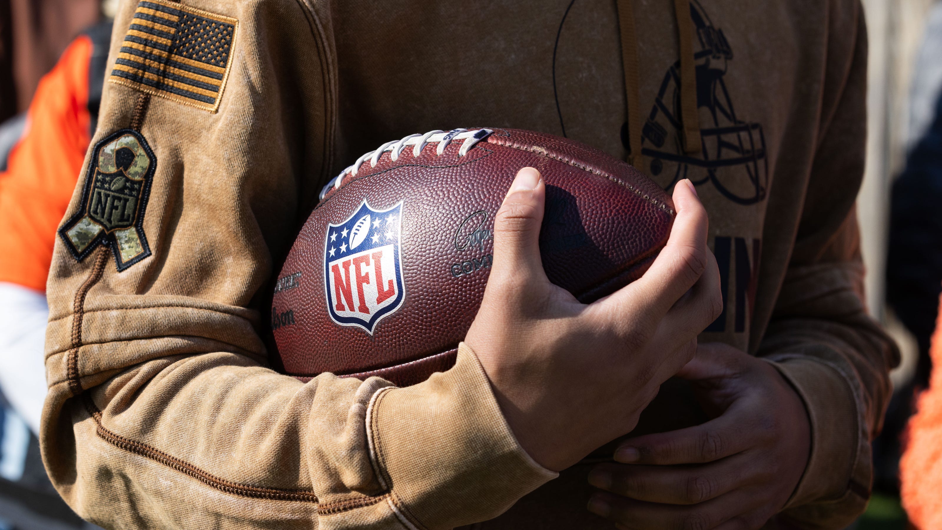 Why NFL Wearing Brown Sweatshirts? The Answer Might Surprise You.
