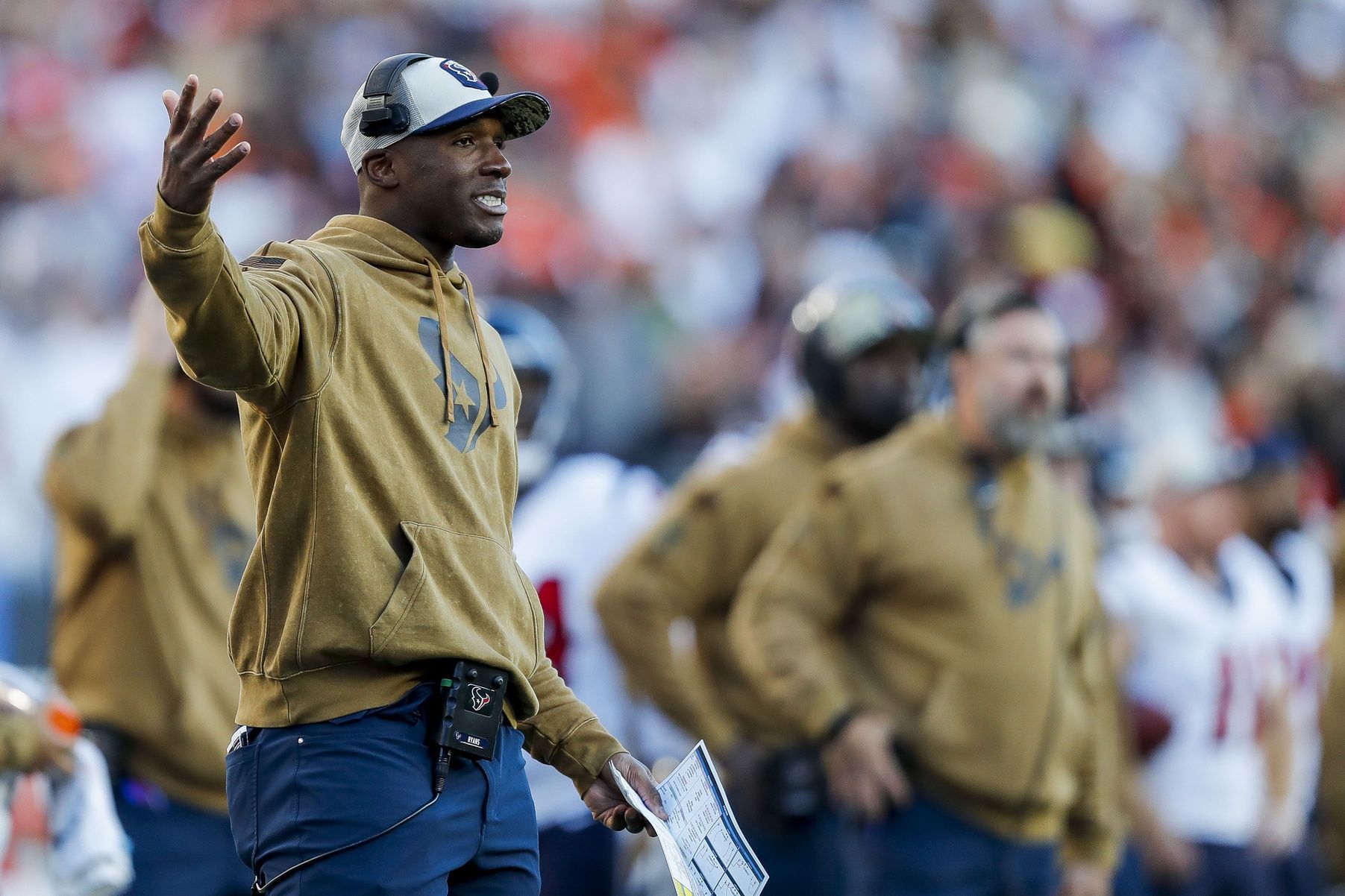 Why are all NFL coaches wearing brown outfits? Get the real story here.